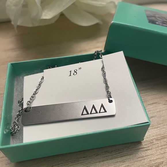 tri delta Jewelry - NWT Tri Delta Bar Necklace Silver plated letters 18” chain in box